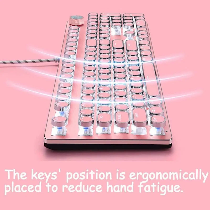 Pink and silver mechanical keyboard with green switches and white backlighting, alongside a wired mouse.