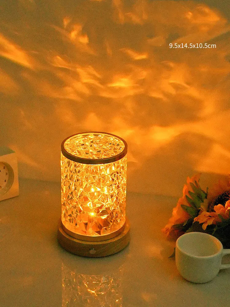 Rotating water ripple night light with acrylic dome on a solid wood base.
