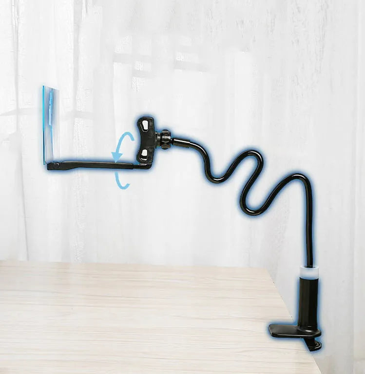 Black 12-inch mobile phone screen amplifier with adjustable bracket on a table.