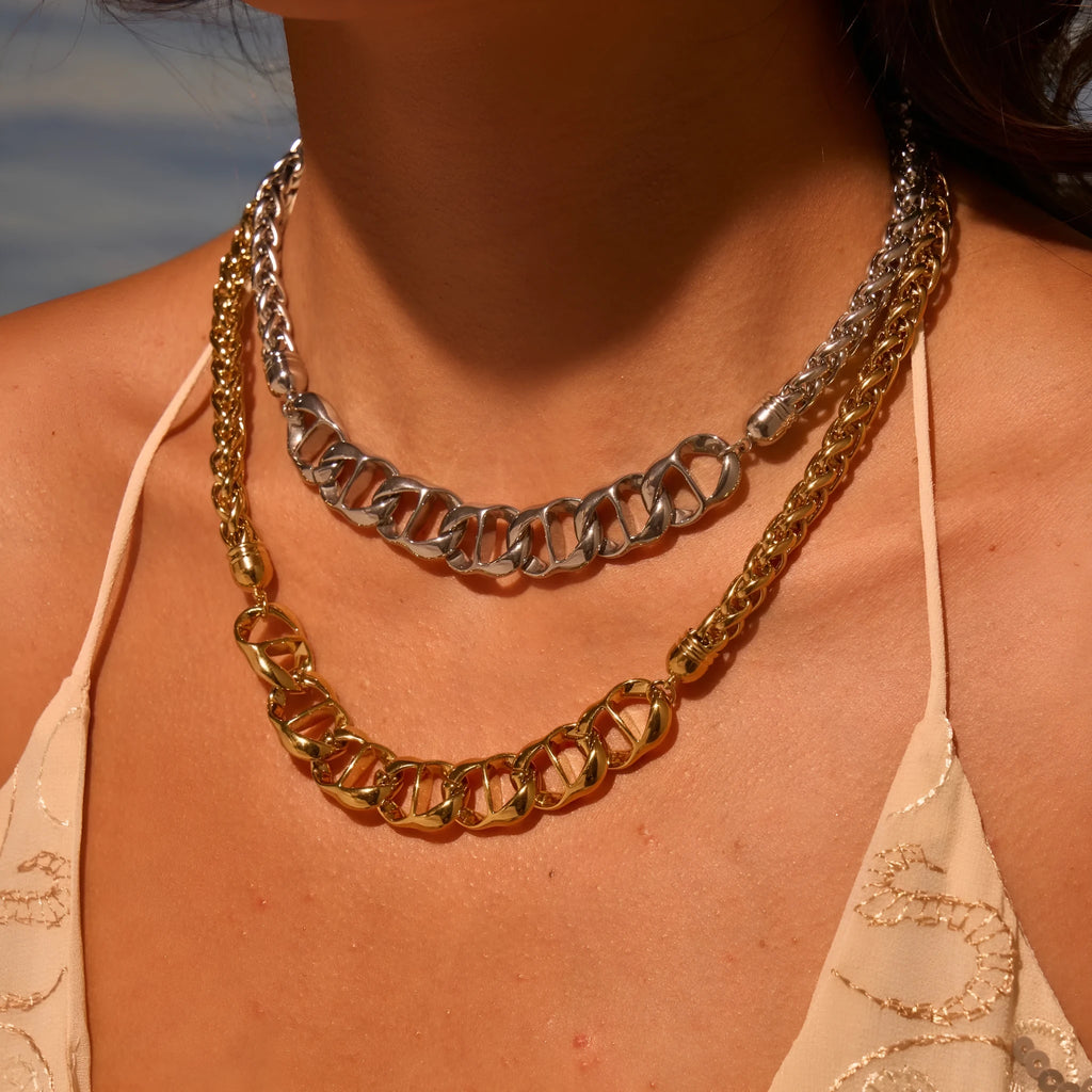 Stainless steel geometric pendant necklace with gold electroplating and chain design details