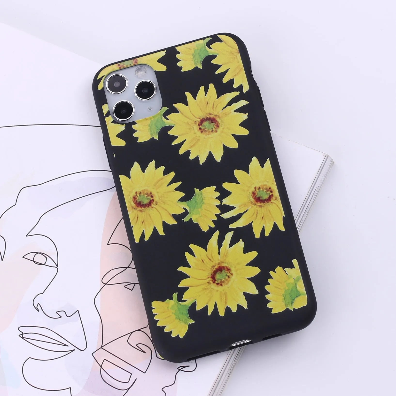 Slim TPU mobile phone case for iPhone on a table, showing one of 14 available colour options.