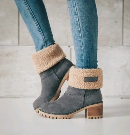 Women's mid-tube suede snow boot in black with a thick heel and round toe.