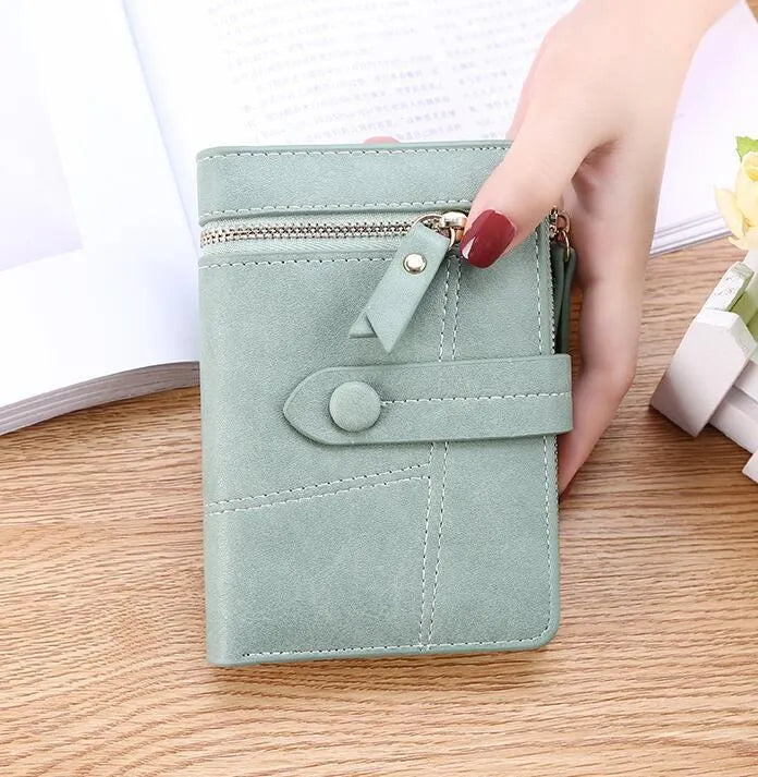 Faux leather standard short wallet with zipper closure, solid colour, showing multiple internal compartments