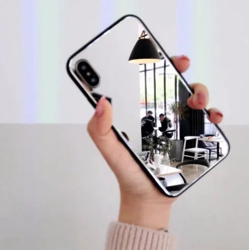 Black iPhone case with a built-in mirror on the back, compatible with iPhone X, 7, and 8 Plus models.
