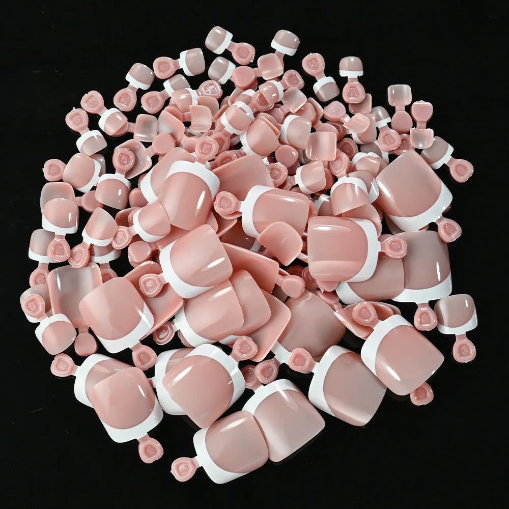 Open box showing 120 French white tip nude square false toe nails in assorted shades.