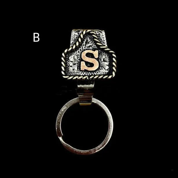 Handmade stainless steel cow tag belt key holder with engraved number plate on a split ring.