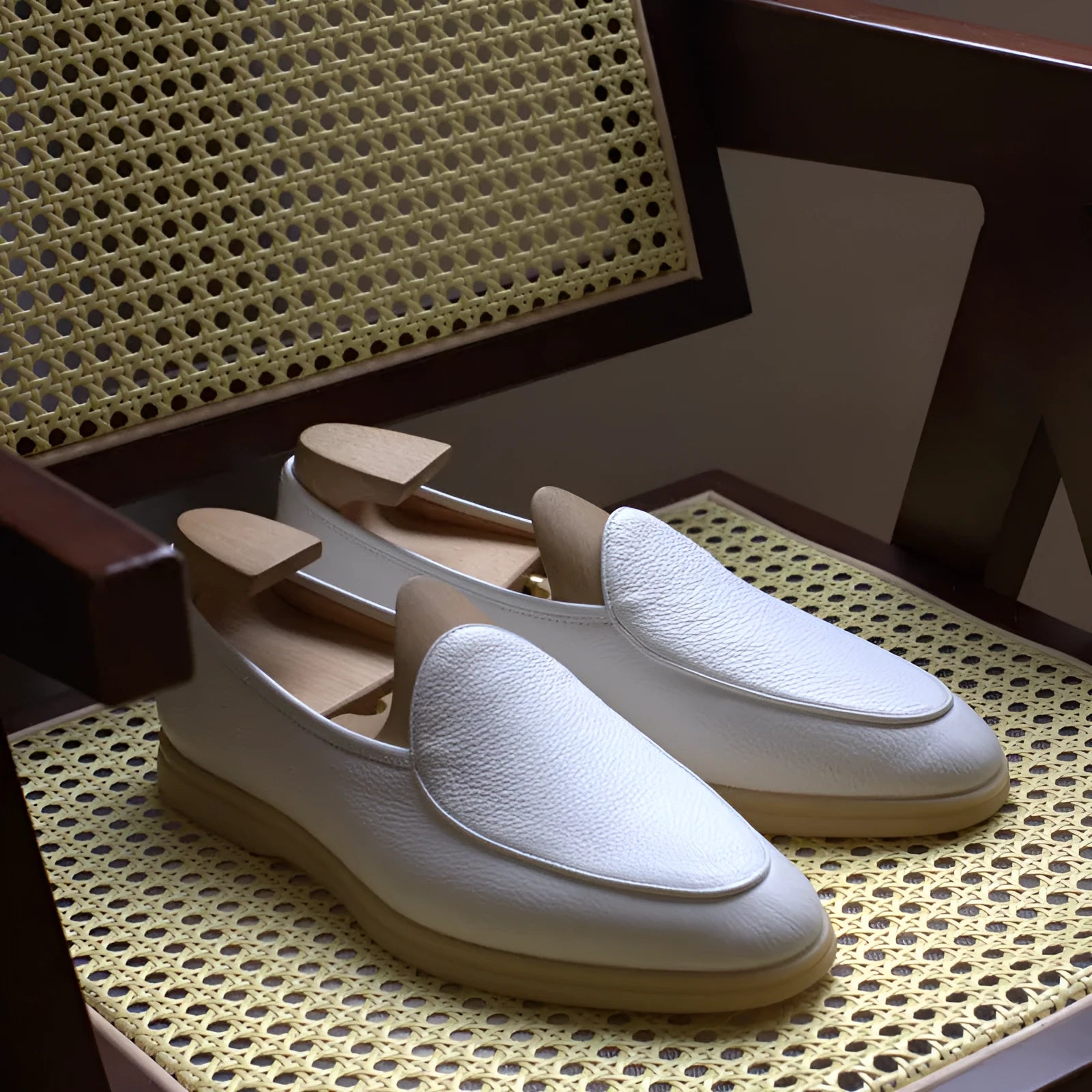 Men's brown genuine leather LP flat loafers with a low cuff, shown on a white background.