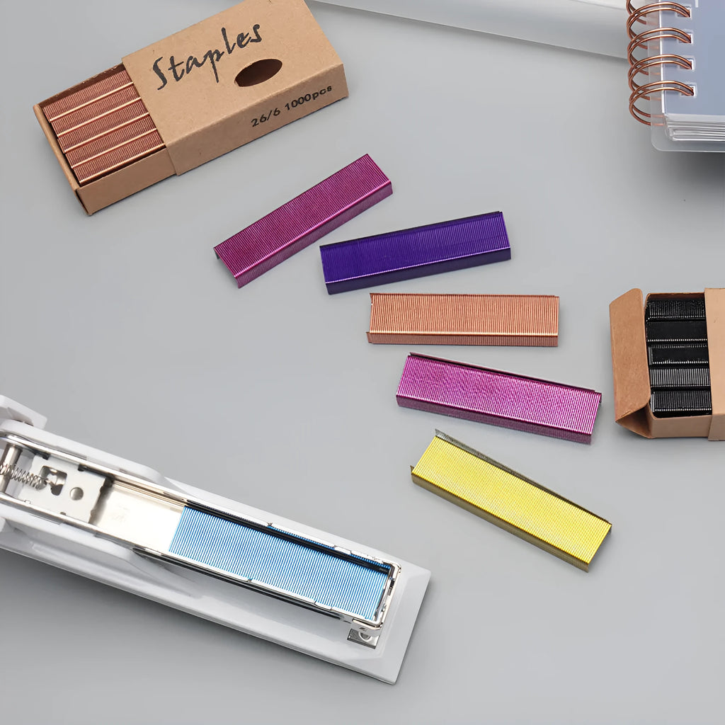 Box of 1000 metal staples for stapler refill in rose gold, black, purple, and rose red colour options.