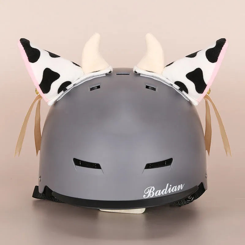 Cute plush cartoon animal character hat designed to decorate a standard ski helmet.