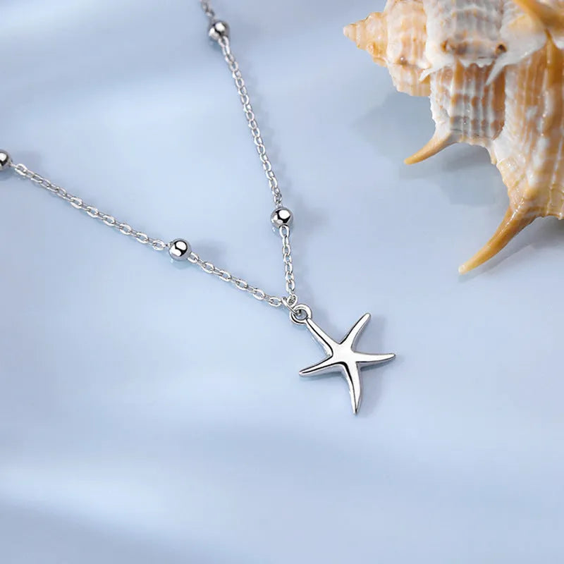 Sterling silver anklet with starfish charm and round beads on chain