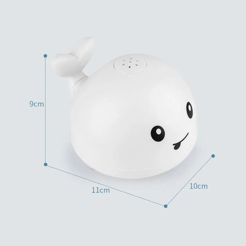 Automatic water spray whale bath toy floating in water with fountain and LED lights
