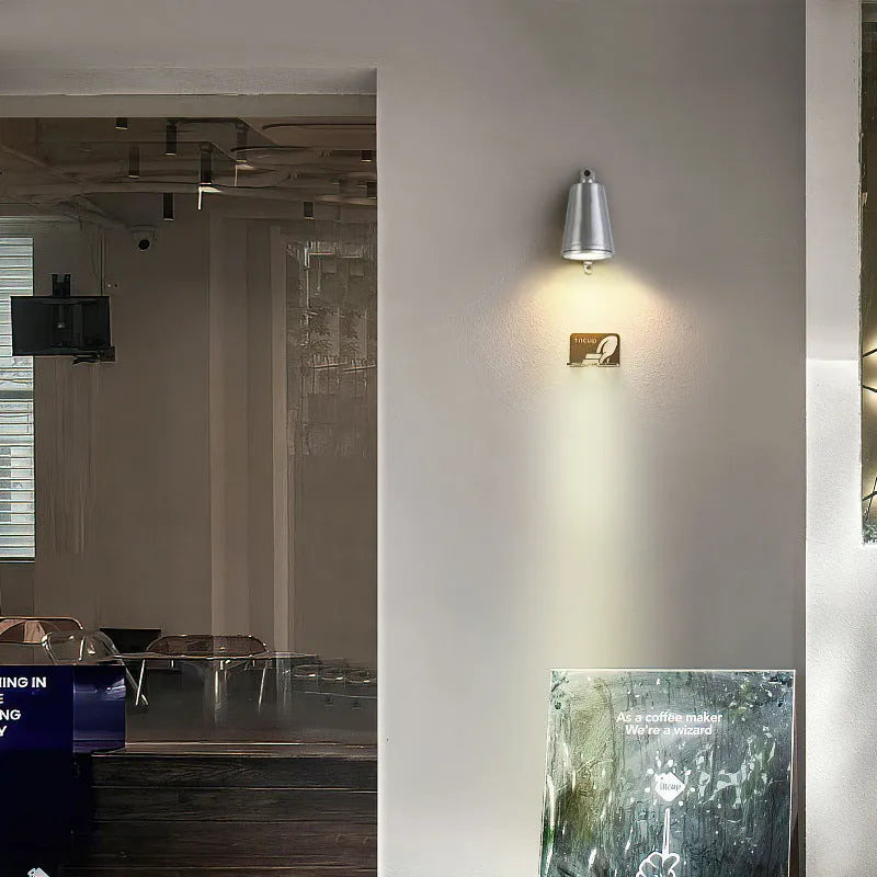 Industrial style cast aluminium outdoor wall lamp with horseshoe shape and sand finish.