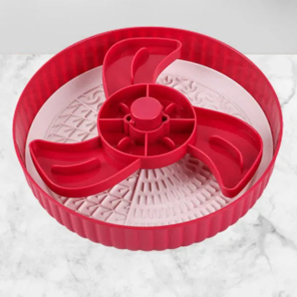 Rotating pet food bowl with silicone slow feeder mat in blue with windmill pattern design