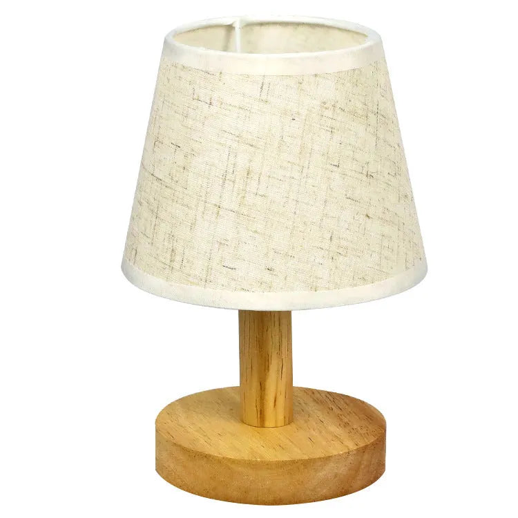 Vintage pleated table lamp with jute and linen shade on bamboo base, featuring USB charging and three-colour dimming.