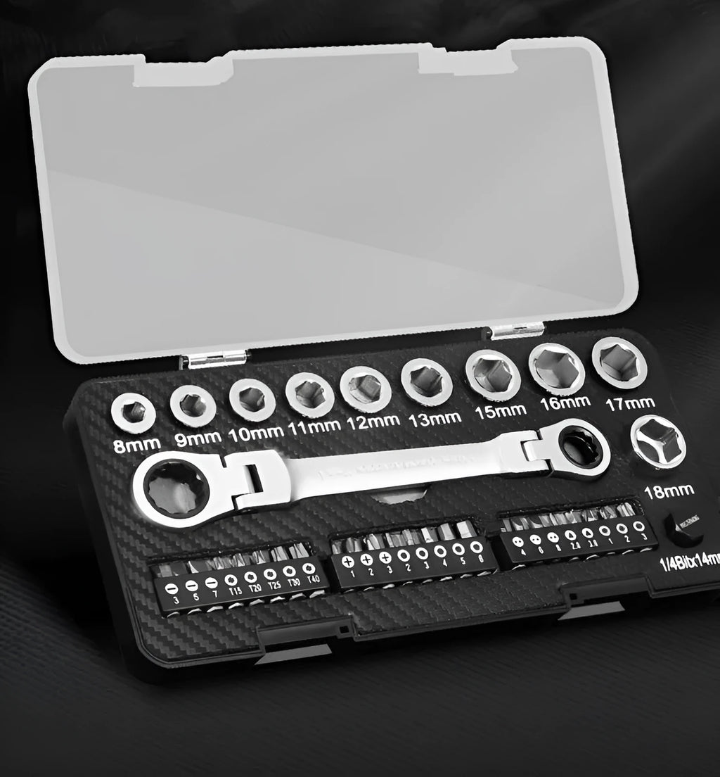 Ratchet wrench set with multiple sockets and bit heads arranged on a workbench