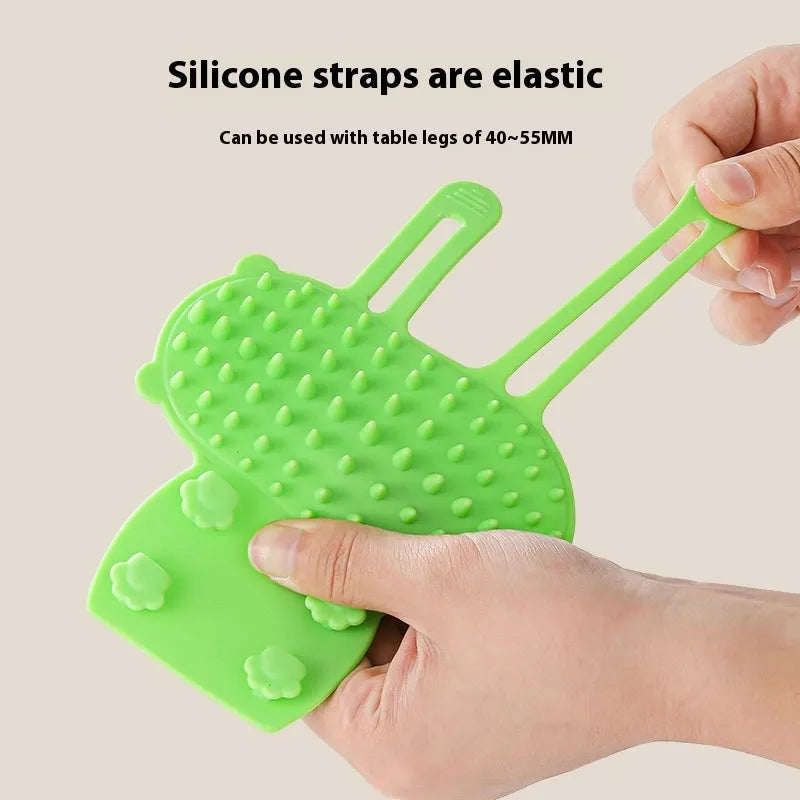 Silicone cat hair removal massage comb attached to a wall corner with rounded teeth for grooming