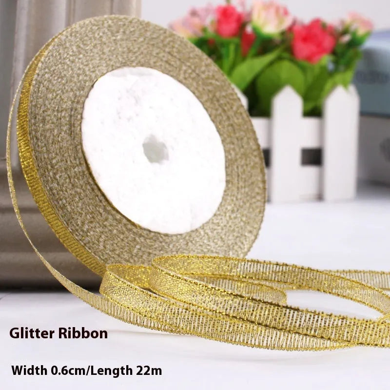 Roll of 0.6cm wide polyester gift ribbon in various colours including gold leaf, coffee and sky blue options