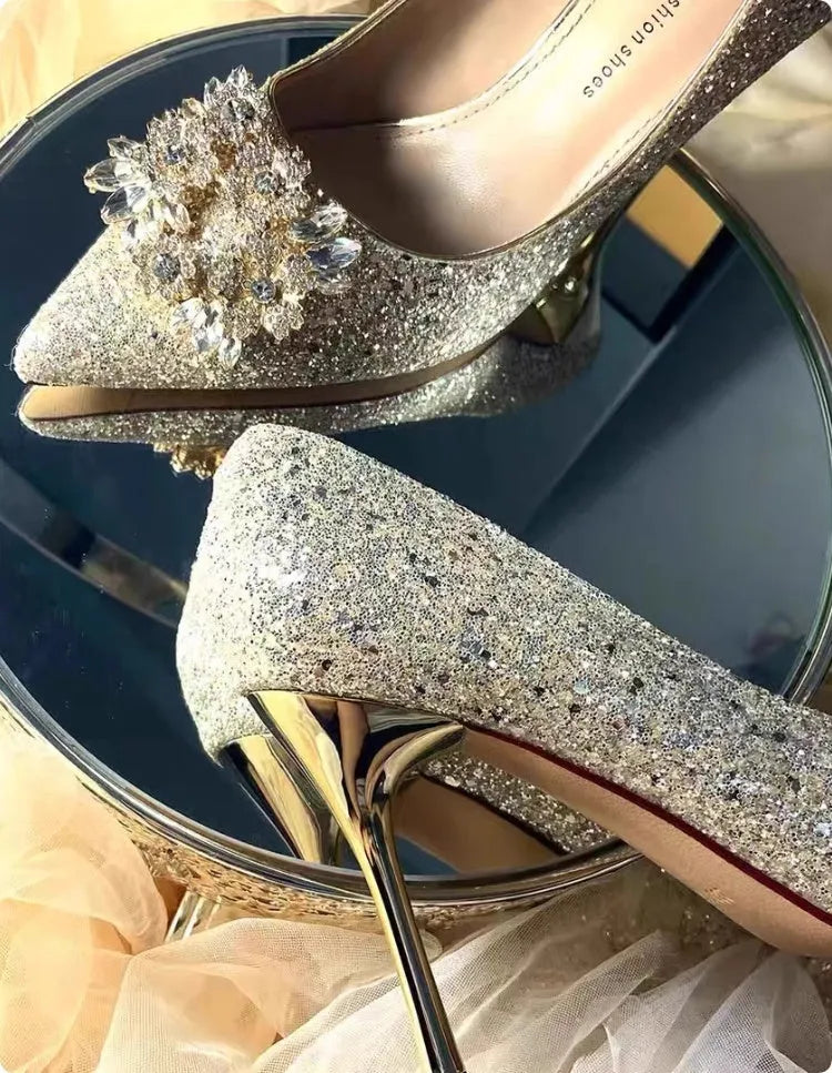Champagne coloured pointed toe bridal heels with rhinestone patterns on a fine heel.