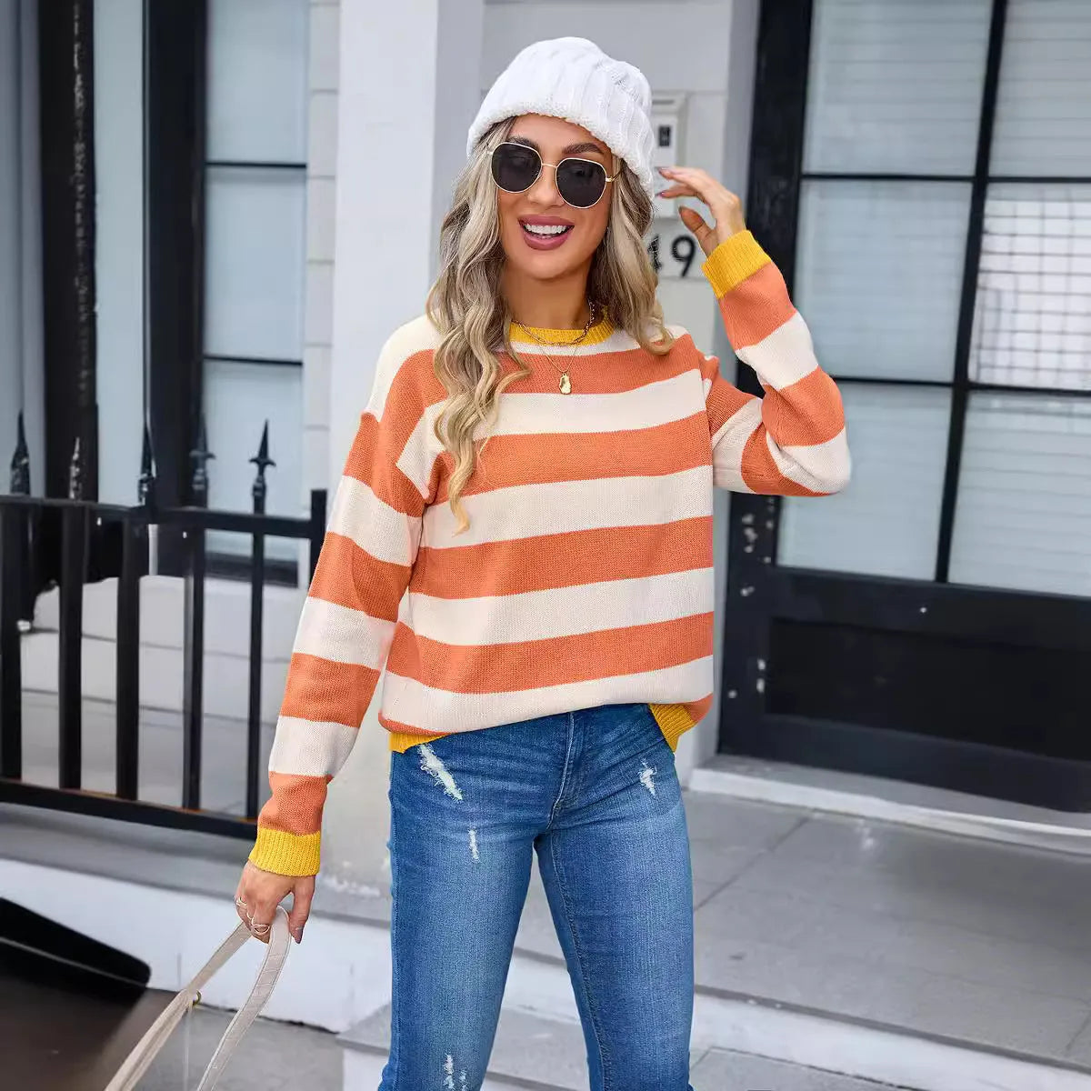 Women's loose-fit acrylic sweater with a floral striped pattern in a blue colour.