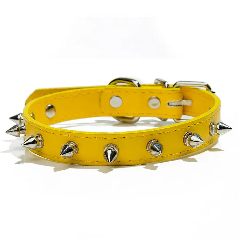 Studded dog collar in black PU leather with metal spikes and alloy buckle.