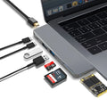 Silver 8-in-1 USB-C hub for MacBook Pro with multiple ports including USB 3.0, HDMI, and card slots