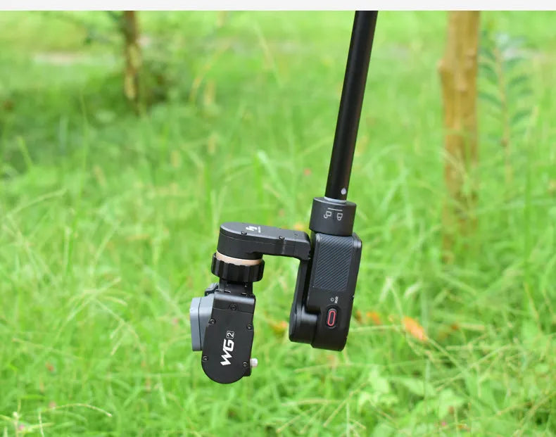 Black aluminium retractable selfie stick with stabilizer, shown extended and with built-in tripod stand.