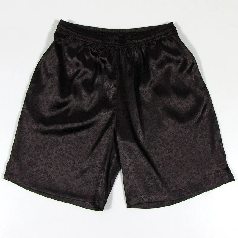 Men's black Tai Chi shorts with an elastic drawstring waistband on a white background.