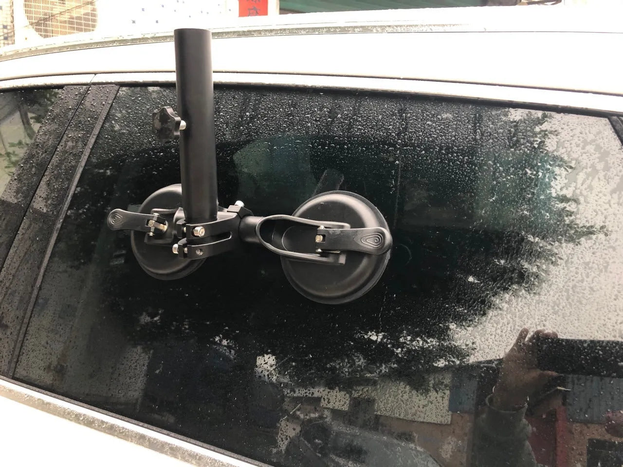 Black off-road car flagpole sucker base with round glass suction cup and rubber disc.