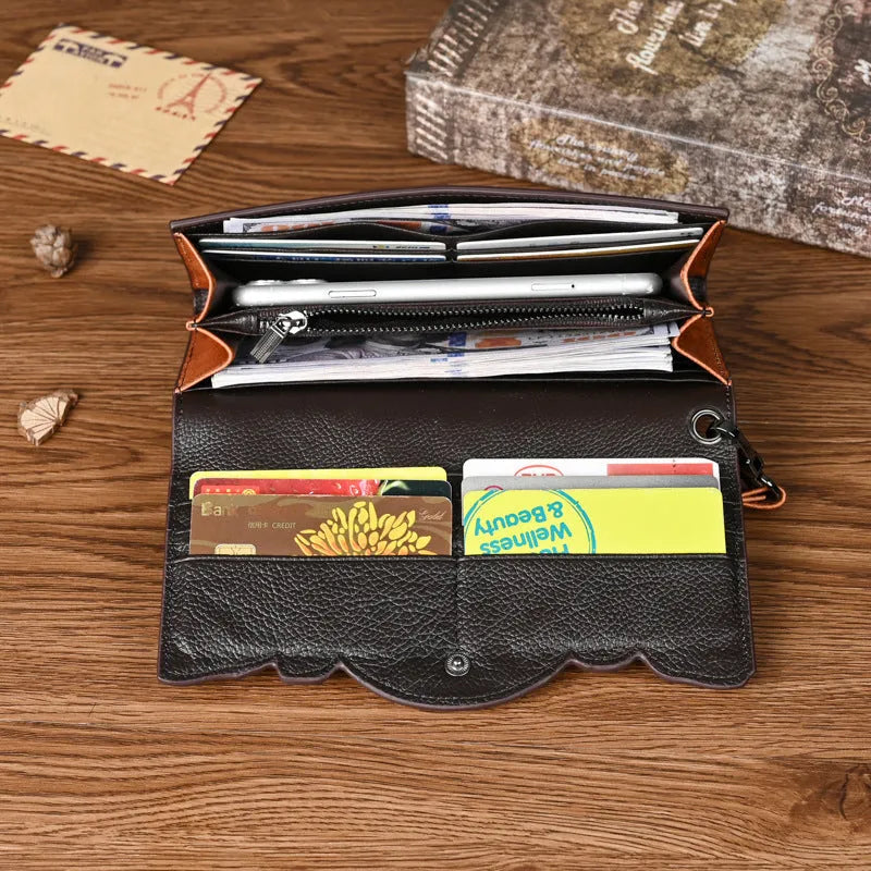 Women's retro brown tri-fold leather wallet with an embossed Chinese floral pattern, shown open.