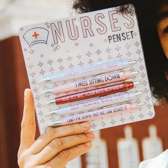 Five nurse-themed retractable ballpoint pens showing plastic construction and medical humour design elements