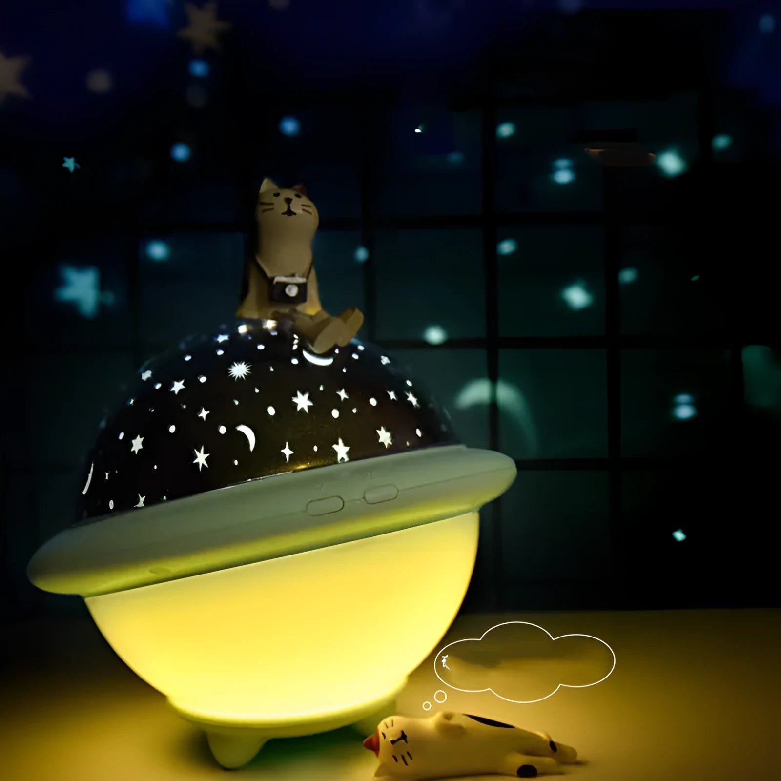 UFO-shaped plastic starry sky projection light in green colour showing rotating LED display