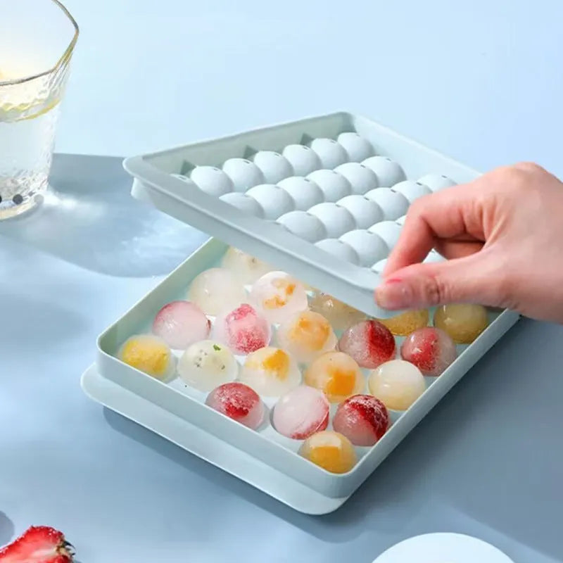 Large blue silicone ice cube tray with 33 round grids and a clear lid