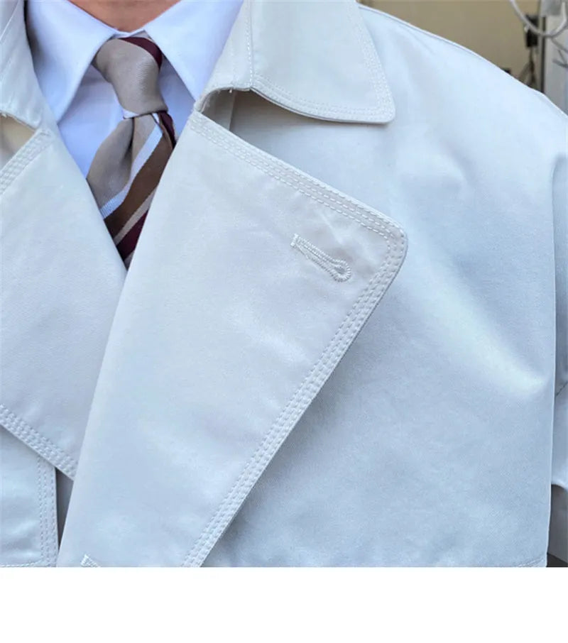 Mid-length trench coat with double-breasted lapels in black, washing finish, 65% cotton 35% polyester