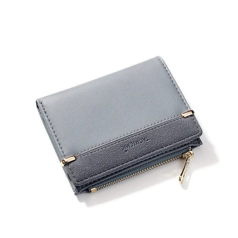 A closed ladies short zipper wallet in PU leather, showing its compact 2-fold design.