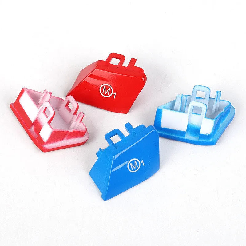 Red and blue BMW M1 M2 steering wheel button accessories with installation keys on a black background