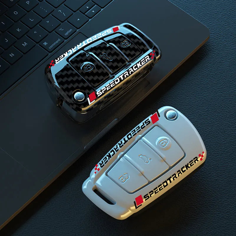 Car key cover with carbon fibre texture and mirrored detailing, white colour option shown alongside