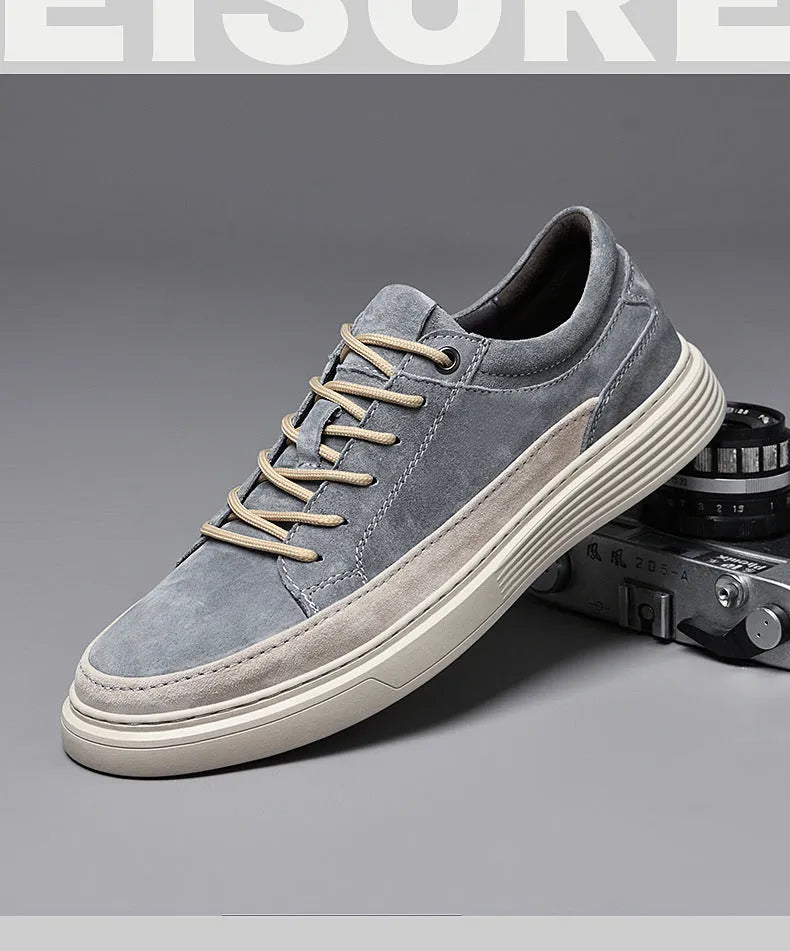 Men's grey casual skate shoes with pigskin upper and rubber sole showing lace-up front design