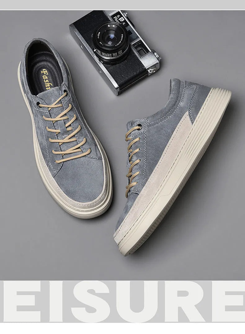 Men's grey casual skate shoes with pigskin upper and rubber sole showing lace-up front design