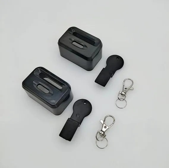 Black ABS plastic seat belt lock clamp holder securing car seat belt buckle