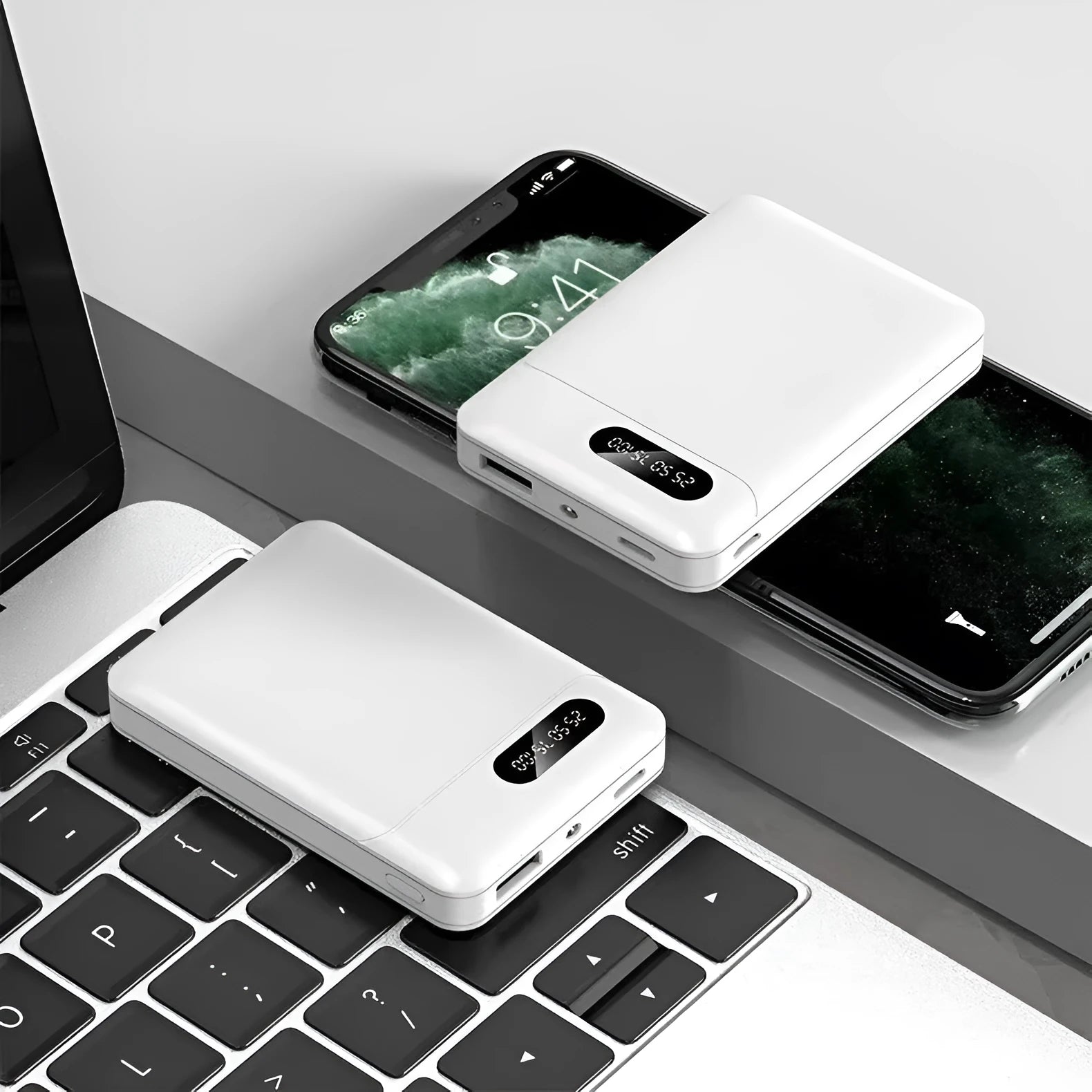 Black and white portable power bank showing dual USB ports and compact 92x63x23mm dimensions