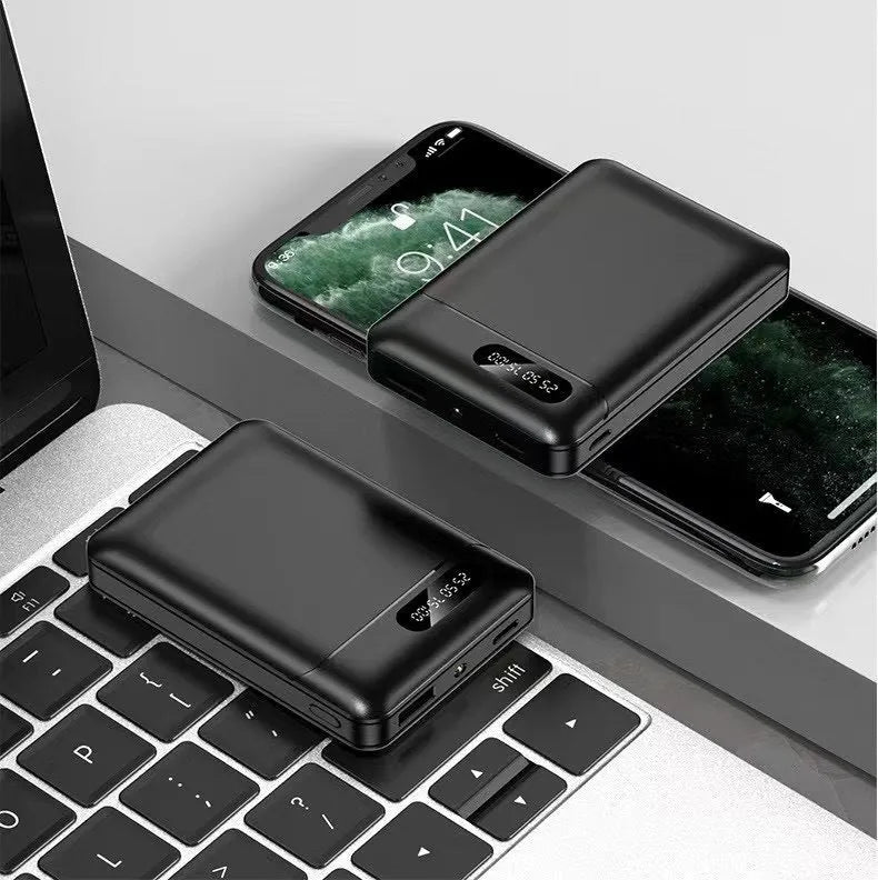 Black and white portable power bank showing dual USB ports and compact 92x63x23mm dimensions