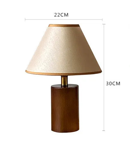 Brown cylindrical wooden bedside lamp with beige cover and E14 bulb base