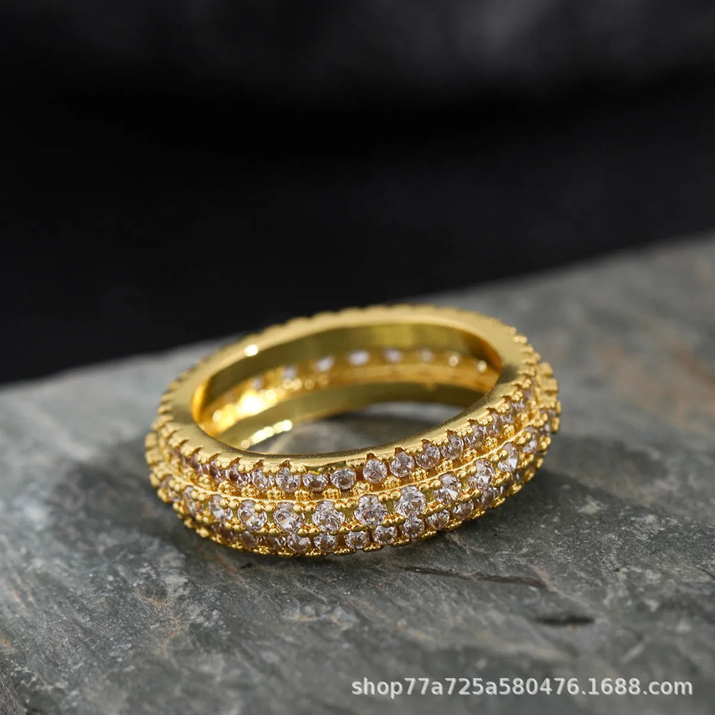 Geometric triangular copper ring with inlaid zircon stones in a choice of three metal finishes.