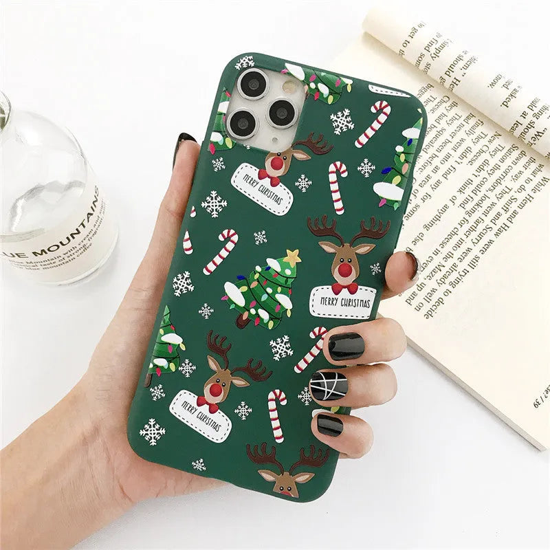 Green TPU iPhone case with cartoon Christmas tree and elk design for multiple models.
