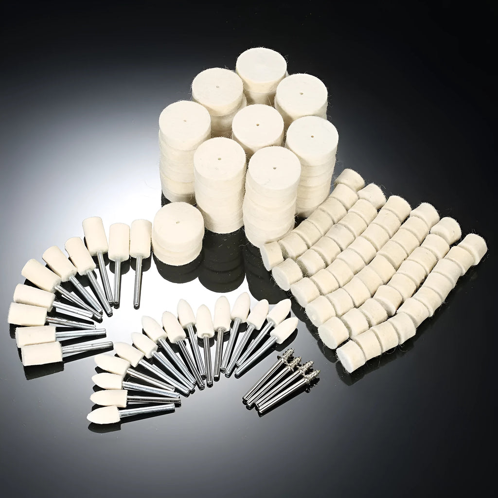 Polishing wheel accessories 129-piece set with white wool brushes and metal grinding wheels on a workbench