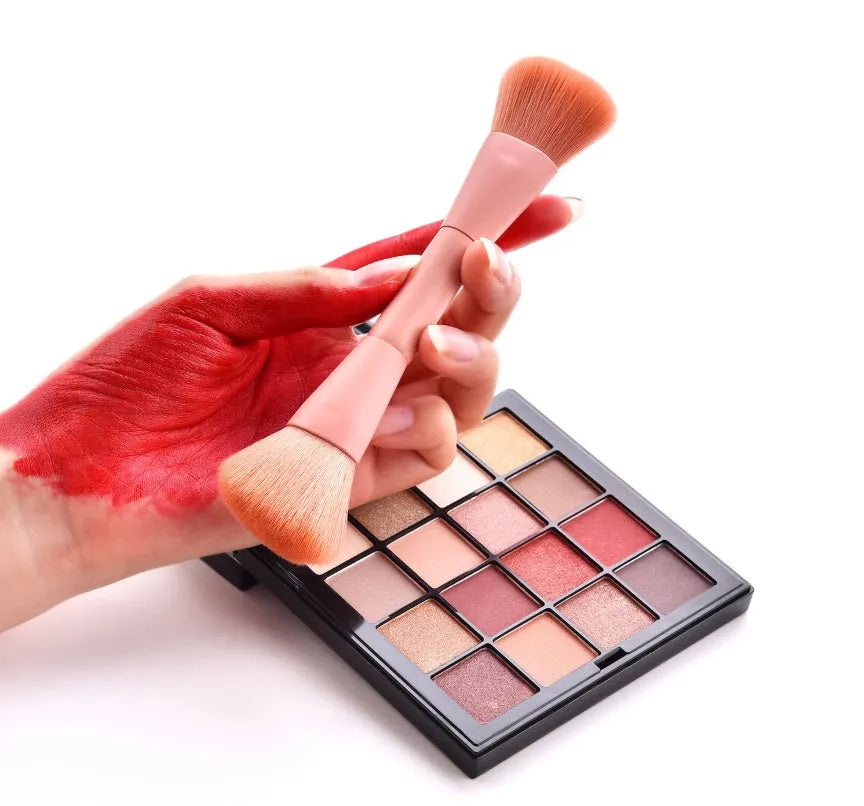 Ten makeup brushes with wooden handles arranged showing different brush head types including powder, foundation and double-headed tools