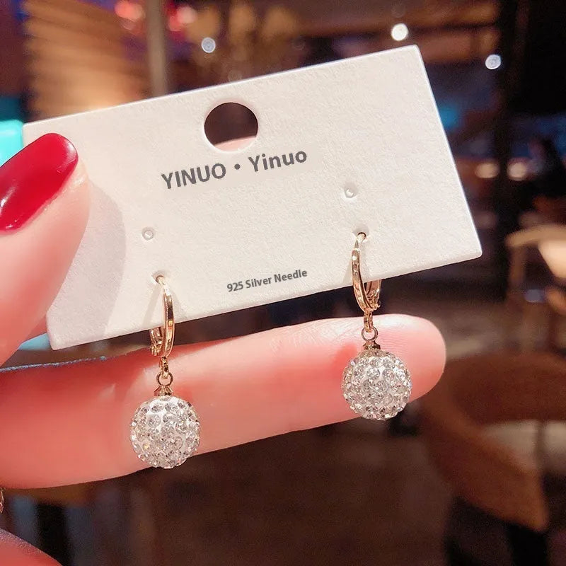Women's geometric copper earrings with zircon and rose design elements in various colours