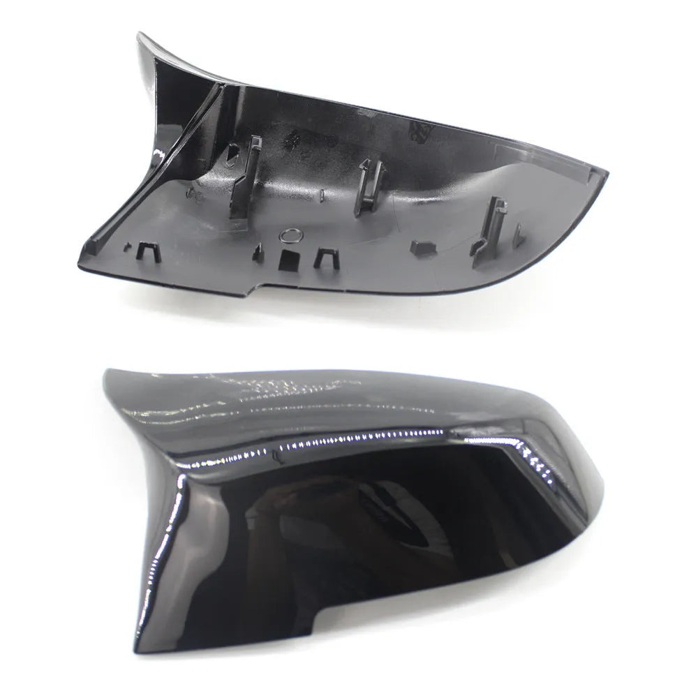 Pair of paint bright black BMW rear-view mirror replacement shells for 3 Series and 4 Series models.