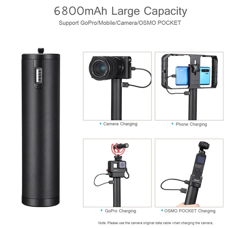 Black aluminium alloy portable power bank with handle, showing compact size next to a mobile phone for scale.