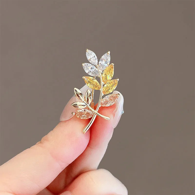Alloy brooch in natural flower shape with electroplated finish, featuring adjustable and anti-exposure pin closure for women's coats and suits.